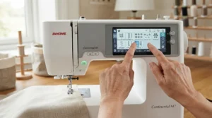 A person using guided stitch selection on a computerised sewing machine for beginners to make decorative hems.